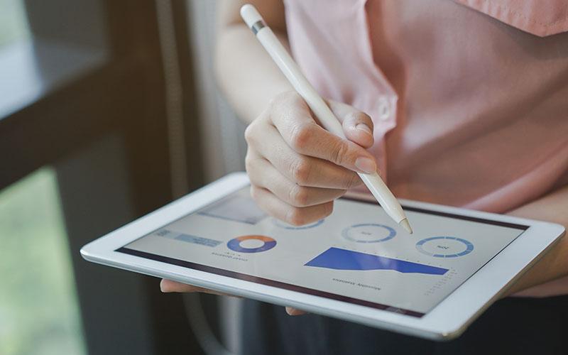 Person looking at data on tablet