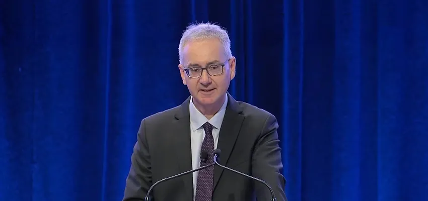close up photo of John Lonsdale, delivering speech.
